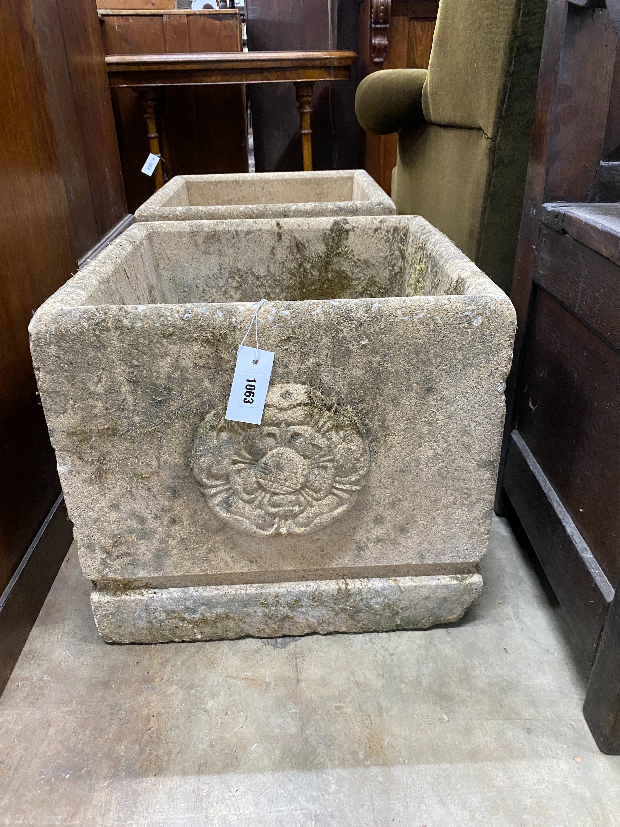 A pair of square reconstituted stone Fleurs de Lys garden planters, width 45cm, height 42cm